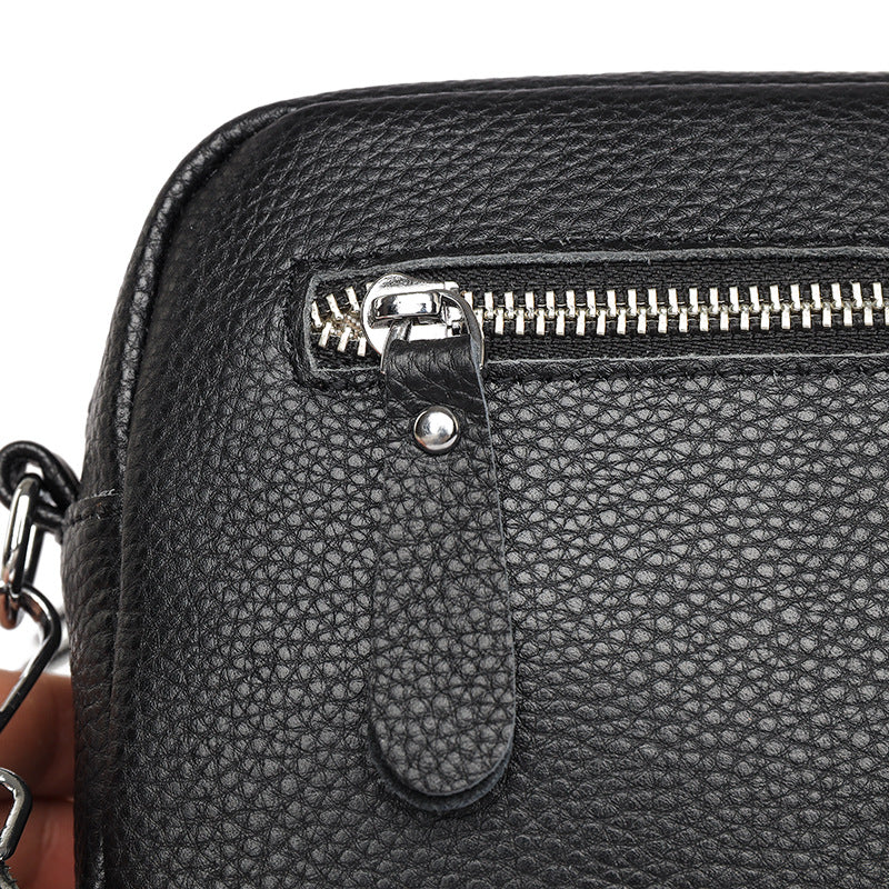 Kleine leren crossbody tas met brede band